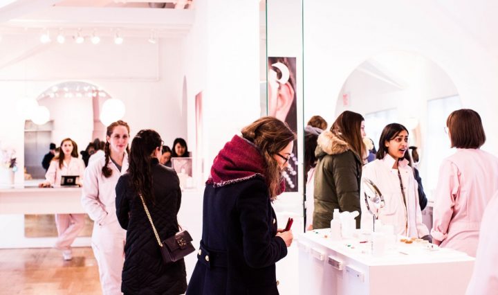 women in a shop selecting makeup, appearance